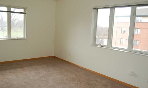 Empty Bedroom with Two Windows