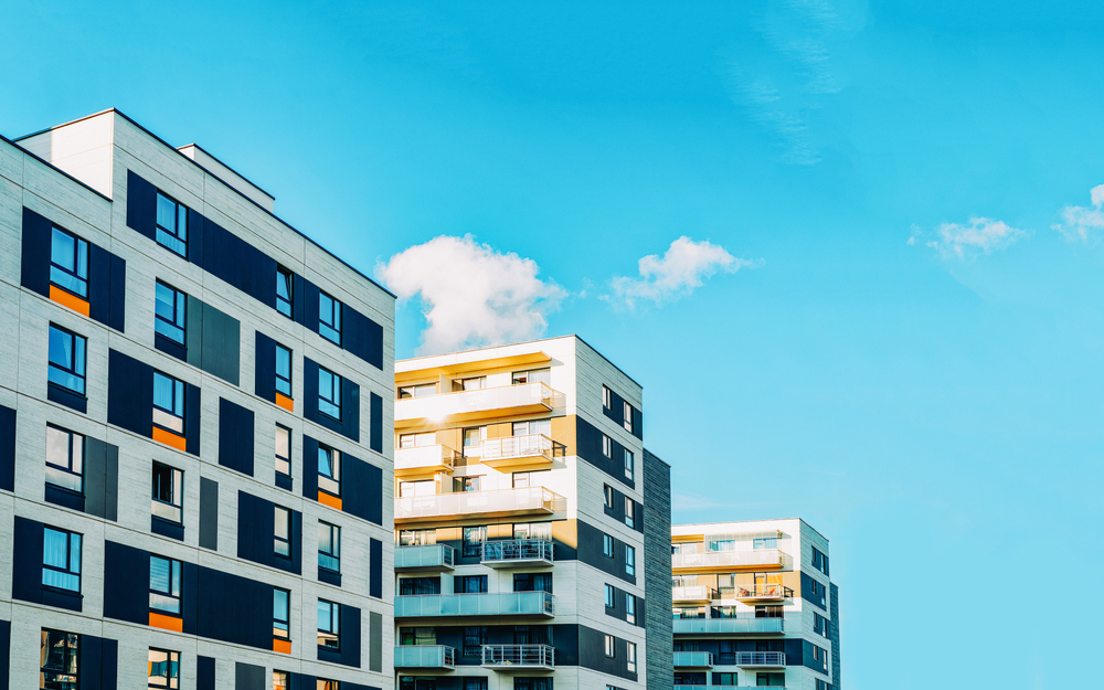 Exterior of apartment buildings on a sunny day.